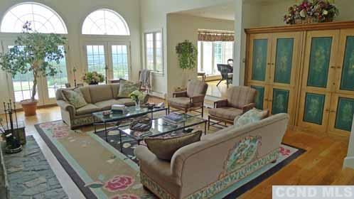 969 Center Hill Road Copake, NY 12516 - Photo 3 of 10 a living room with furniture and a large window