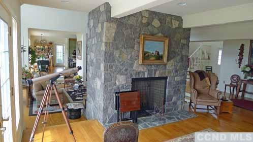 969 Center Hill Road Copake, NY 12516 - Photo 4 of 10 a living room with furniture and a fireplace