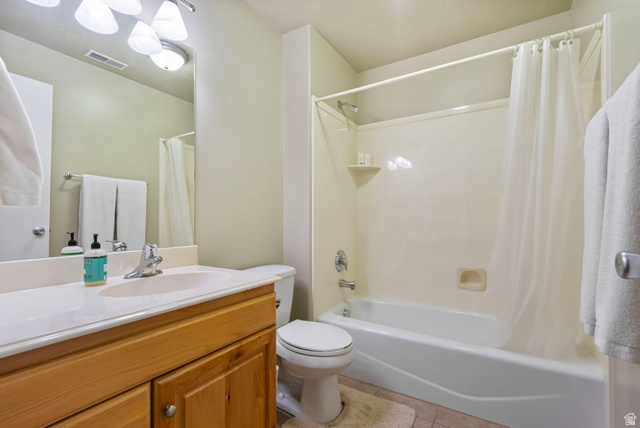 557 South 1470th Street East Springville, UT 84663 - Photo 25 of 46 Full bath featuring vanity, shower / bathtub combination with curtain, and light tile patterned floors