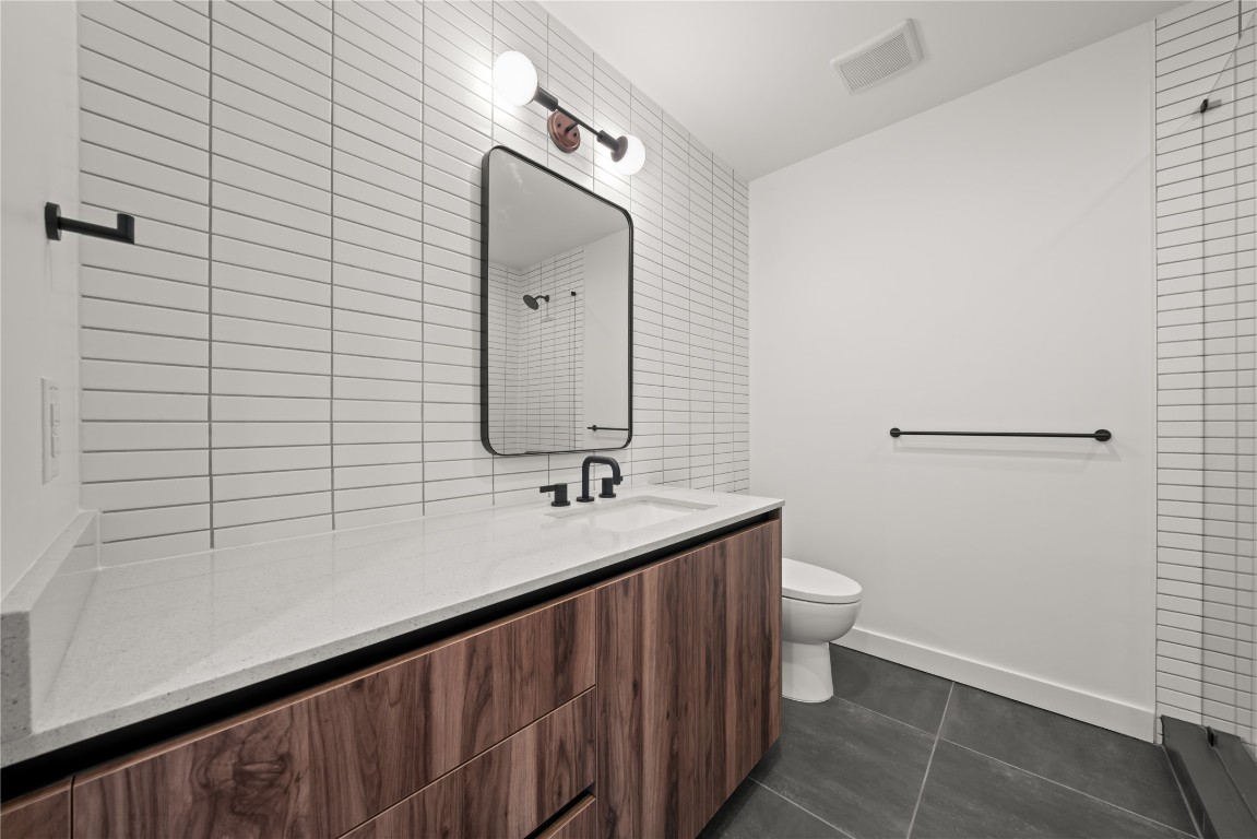 84 East Avenue, Unit 1708 Austin, TX 78701 - Photo 12 of 29 Representative Photo. Primary Bath with spacious vanity, tile to ceiling feature