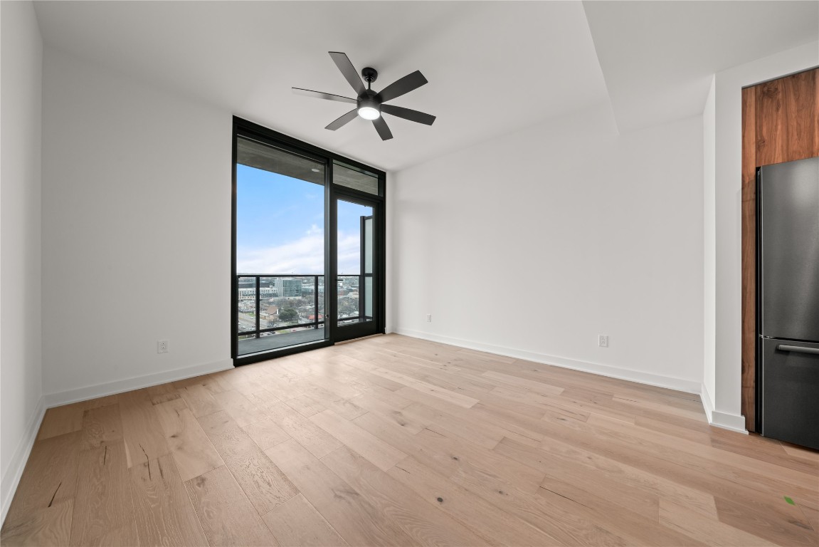 84 East Avenue, Unit 1708 Austin, TX 78701 - Photo 6 of 29 Representative Photo. Open Concept living room with 7.5" wide Bella Cera hardwood flooring throughout, balcony off the living room with a South East view