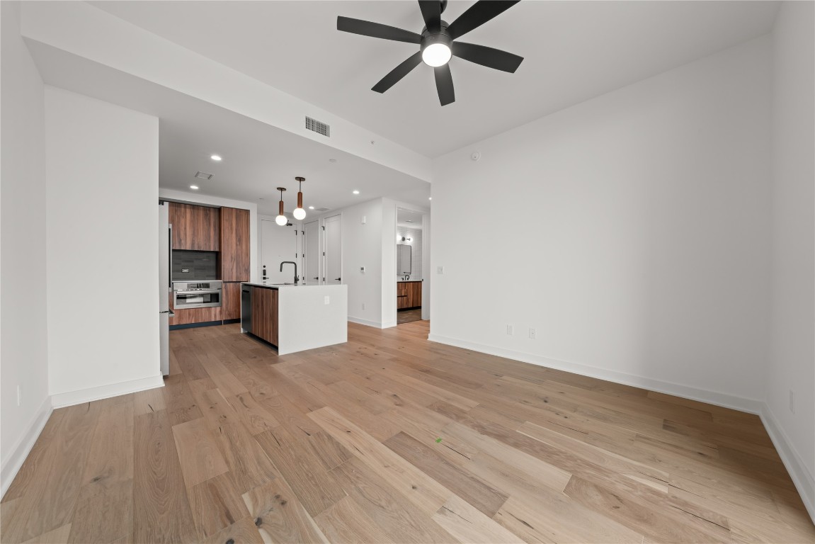 84 East Avenue, Unit 1708 Austin, TX 78701 - Photo 8 of 29 Representative Photo. Open Concept living room with 7.5" wide Bella Cera hardwood flooring throughout, balcony off the living room with a South East view