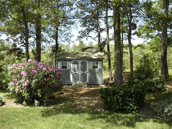 58 Tree Line Drive Barnstable, MA 02648 - Photo 7 of 29 a front view of a house with a yard