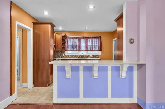a bathroom with a sink a mirror and a shower