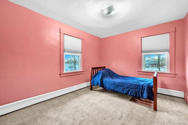 a room with a window and a chair