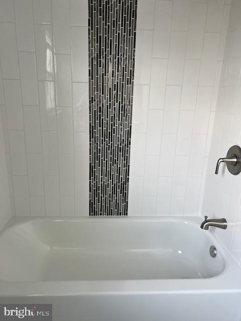206 Stevens Road Middle River, MD 21220 - Photo 18 of 31 Sleek tub with modern tile accents.