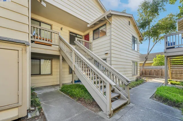 a view of a house with a small yard
