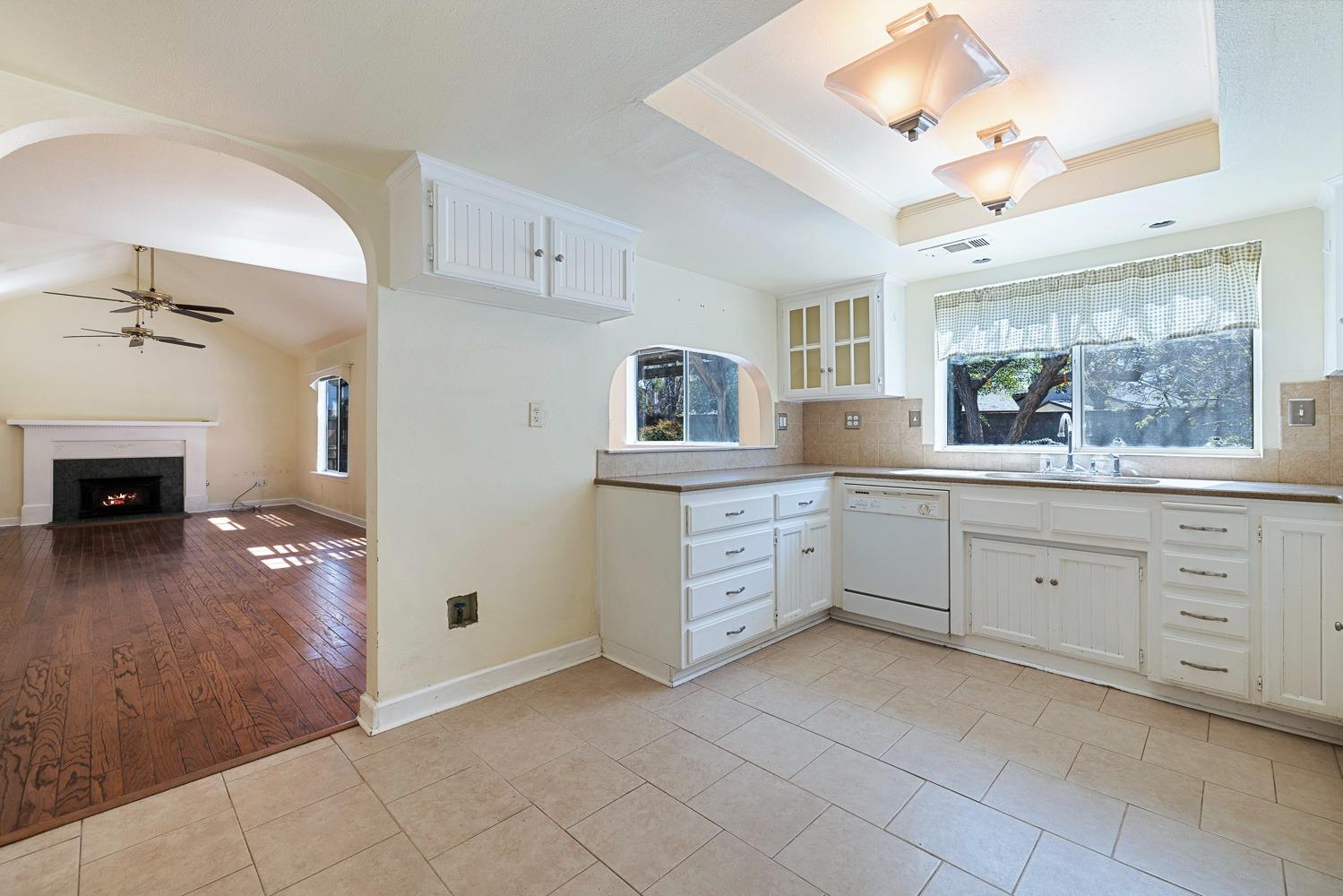 695 Monroe Street Coalinga, CA 93210 - Photo 15 of 44 a spacious bathroom with a granite countertop sink a mirror and a bathtub