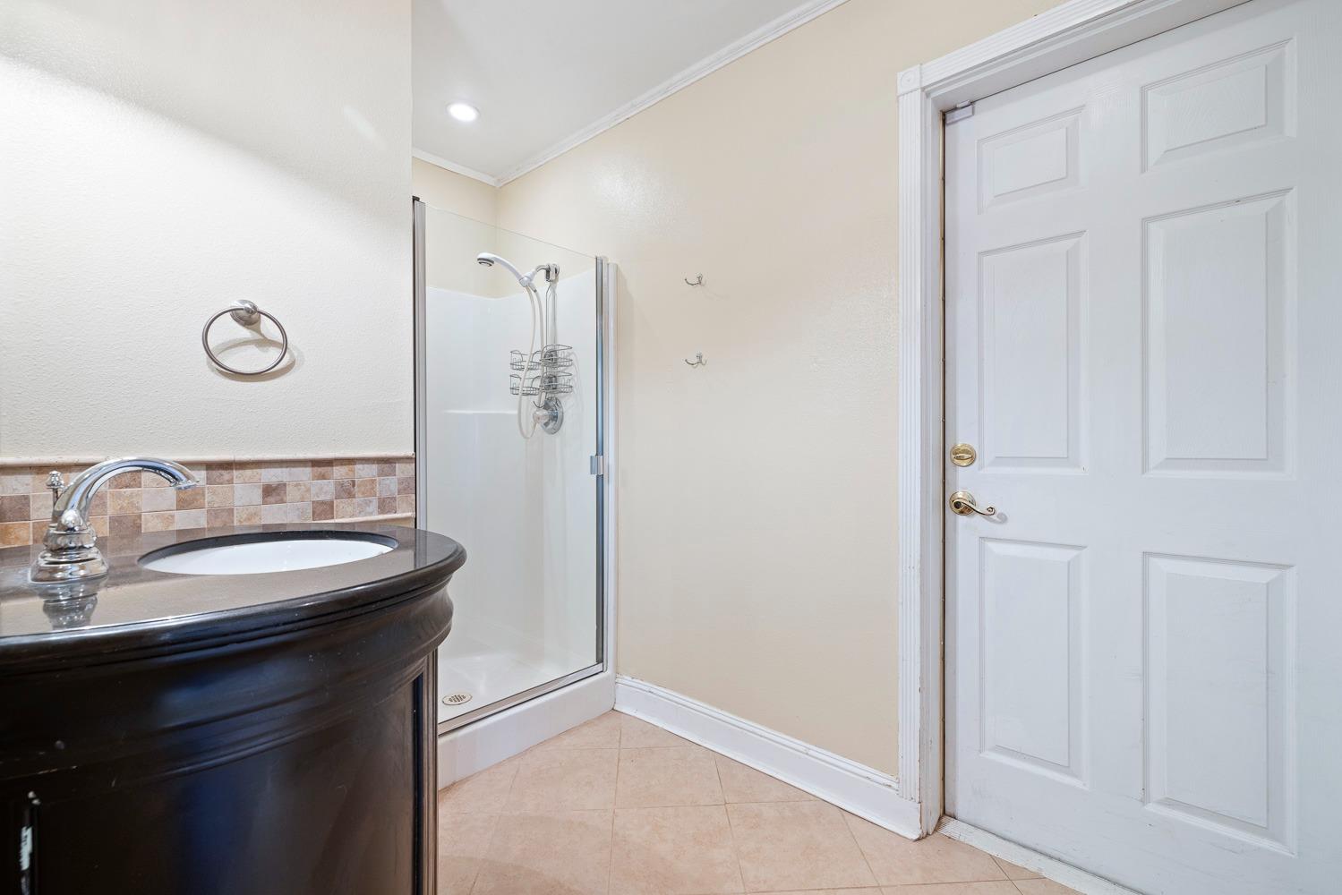 695 Monroe Street Coalinga, CA 93210 - Photo 21 of 44 a bathroom with a sink and a mirror