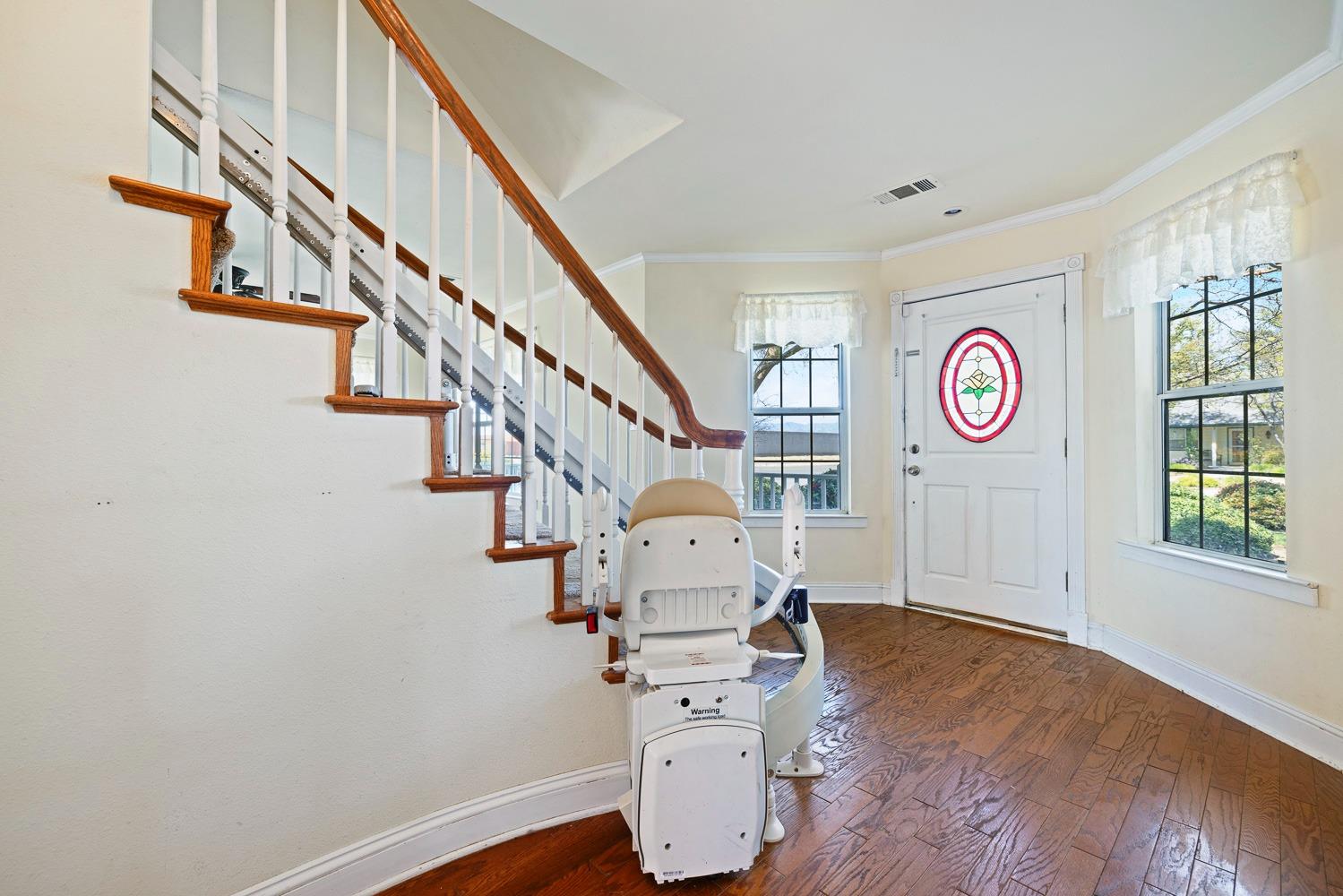 695 Monroe Street Coalinga, CA 93210 - Photo 23 of 44 a view of entryway with wooden floor and staircase