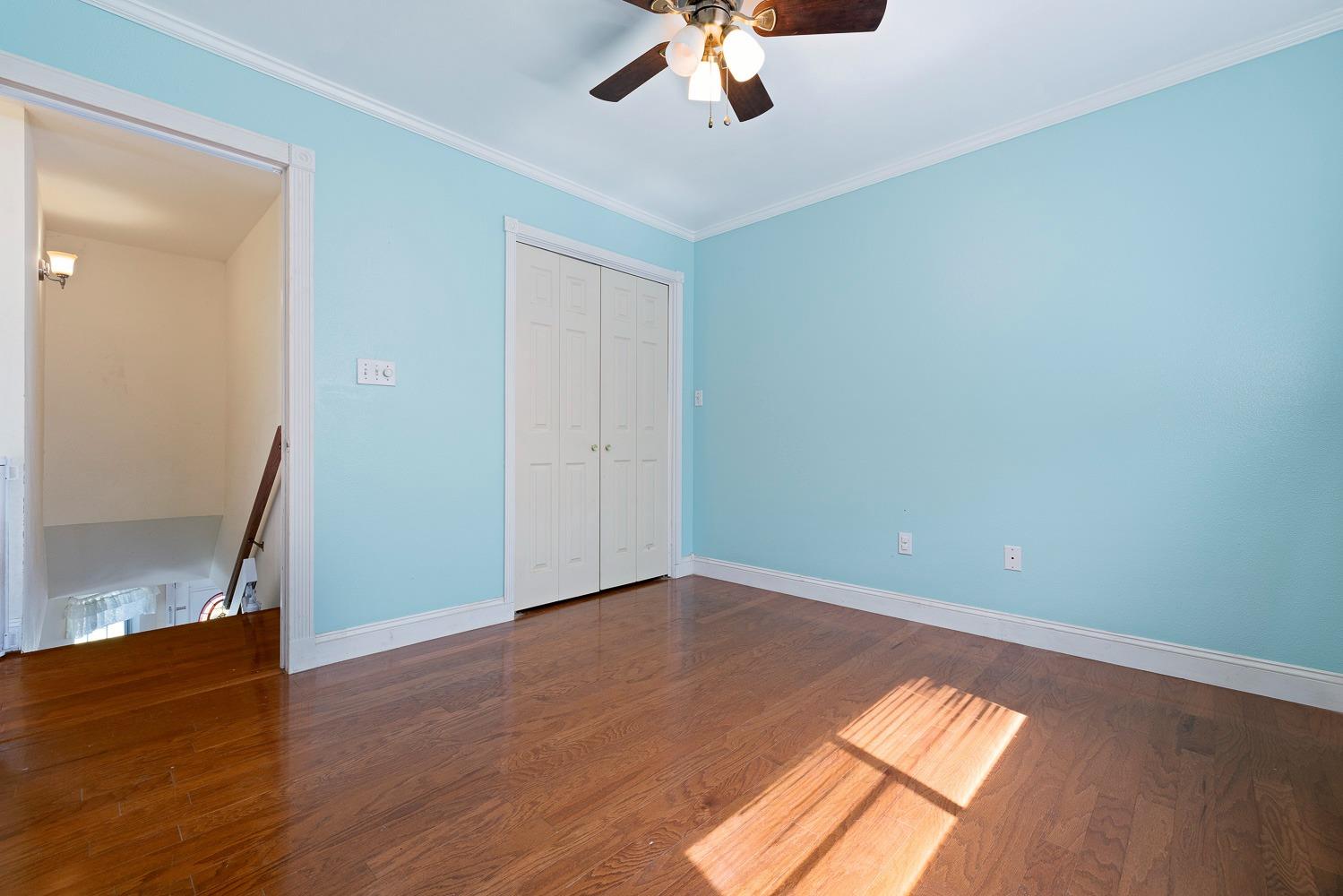 695 Monroe Street Coalinga, CA 93210 - Photo 25 of 44 wooden floor in an empty room with a window