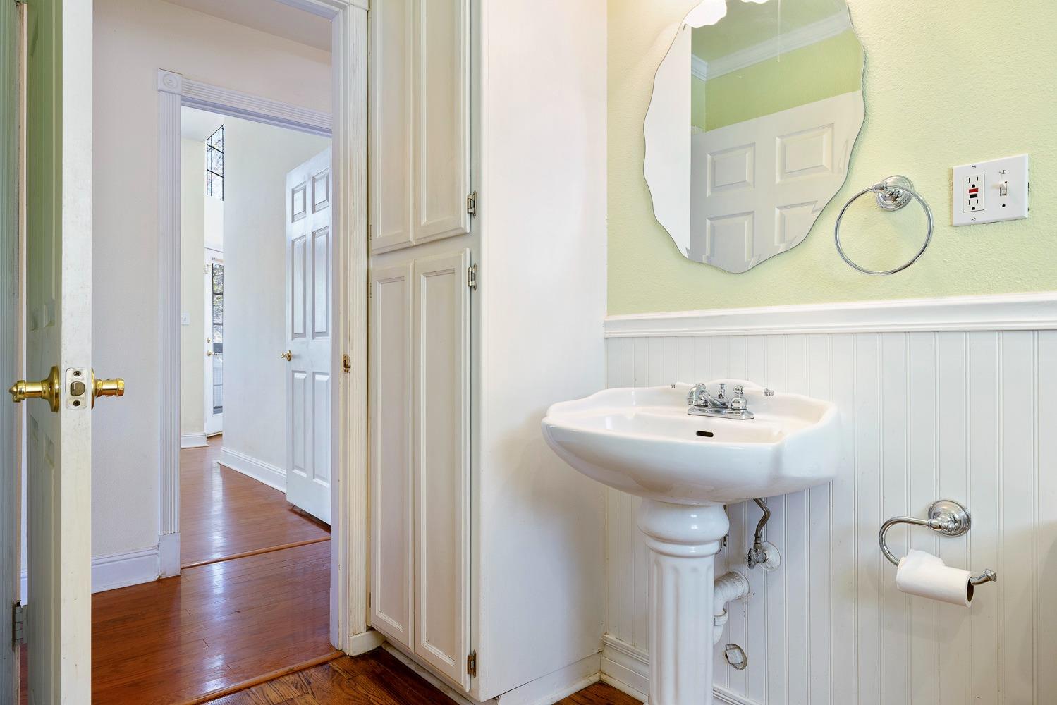 695 Monroe Street Coalinga, CA 93210 - Photo 28 of 44 a bathroom with a sink mirror and vanity