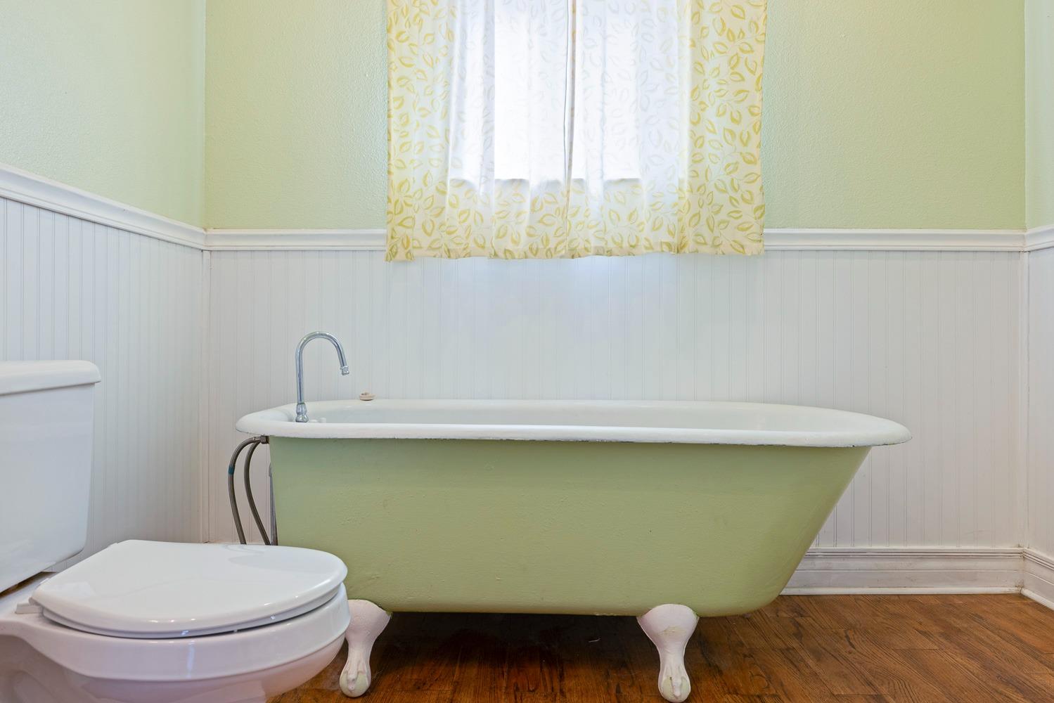 695 Monroe Street Coalinga, CA 93210 - Photo 29 of 44 a bathroom with a toilet and a sink