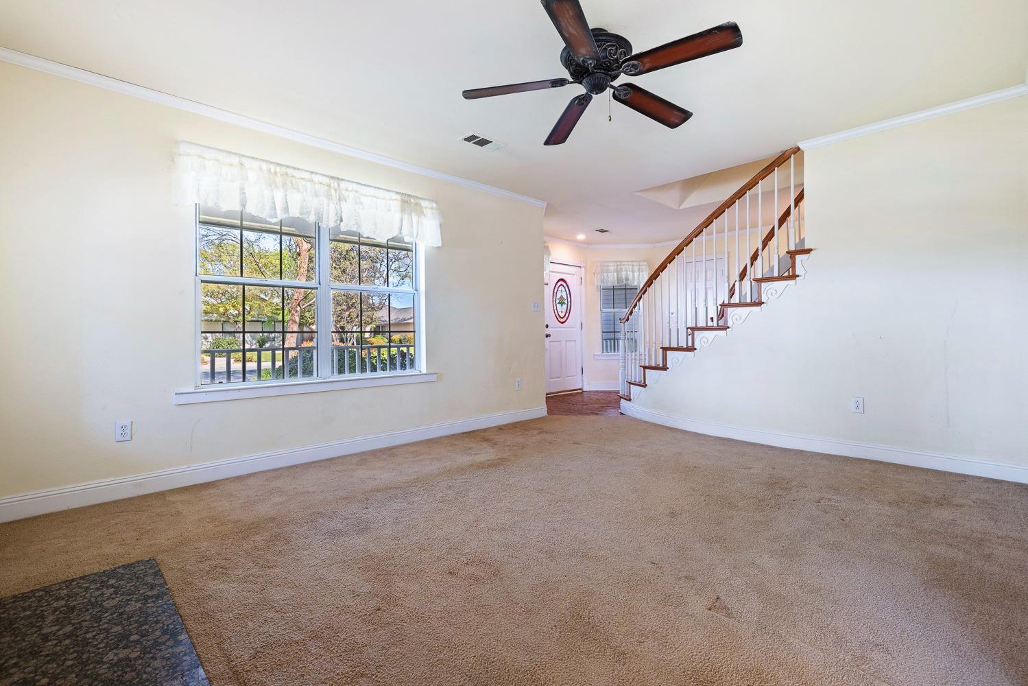 695 Monroe Street Coalinga, CA 93210 - Photo 8 of 44 a view of an empty room with a window