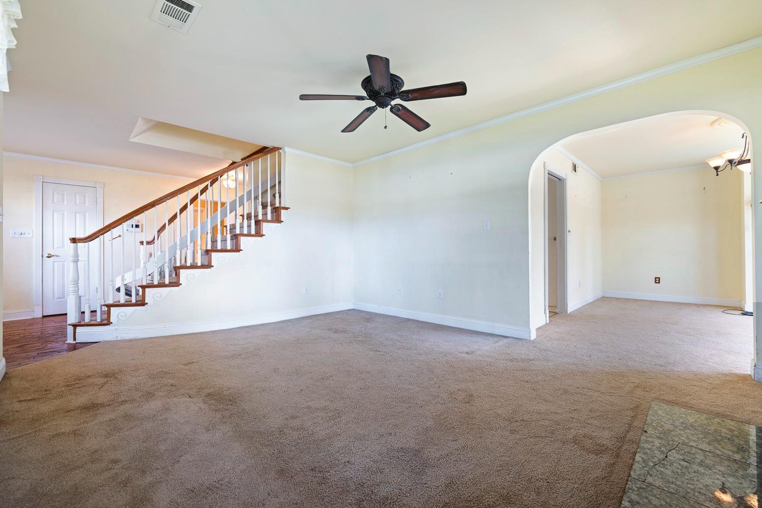 695 Monroe Street Coalinga, CA 93210 - Photo 9 of 44 a view of an empty room with stairs
