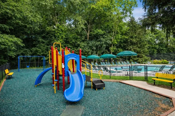 a view of a park with slide and a slide