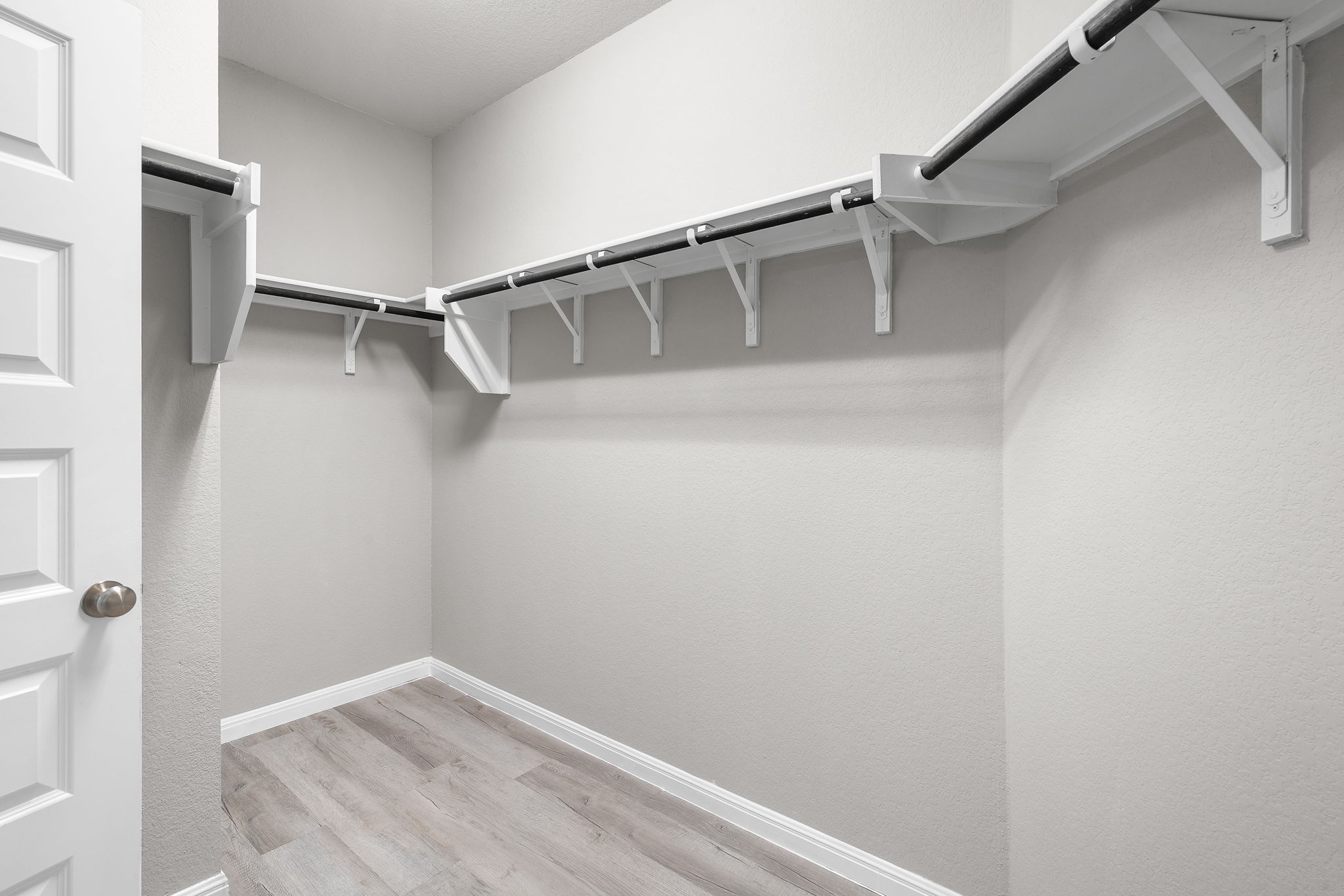 313 Mclintock Road Jarrell, TX 76537 - Photo 27 of 40 Ample hanging space and shelving create an organized wardrobe solution in this practical closet.