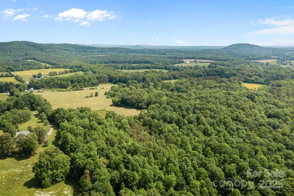 a view of a town with mountains in the background