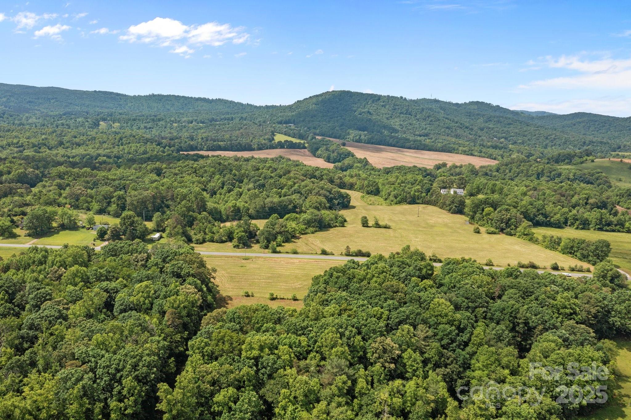 437 Linneys Mill Road Union Grove, NC 28689 - Photo 14 of 16 a view of a town with mountains in the background