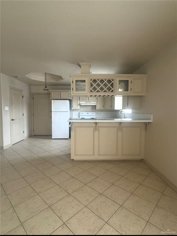 3603 Sheraton Avenue Pharr, TX 78577 - Photo 7 of 9 a kitchen with stainless steel appliances a sink and a refrigerator