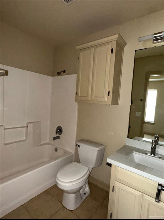 3603 Sheraton Avenue Pharr, TX 78577 - Photo 8 of 9 a bathroom with a toilet a sink a mirror and bathtub