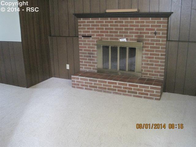 1248 Osgood Road Colorado Springs, CO 80915 - Photo 6 of 17 Fireplace in family room