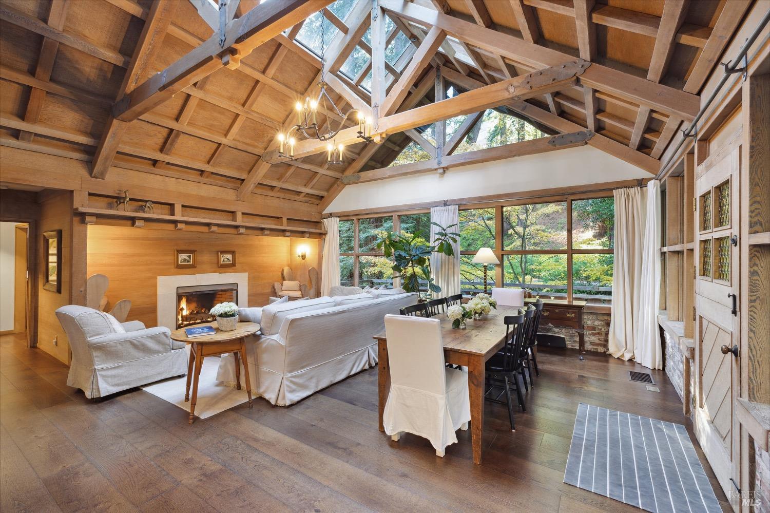 224 Cascade Drive Mill Valley, CA 94941 - Photo 1 of 1 a living room with furniture a fireplace and a table