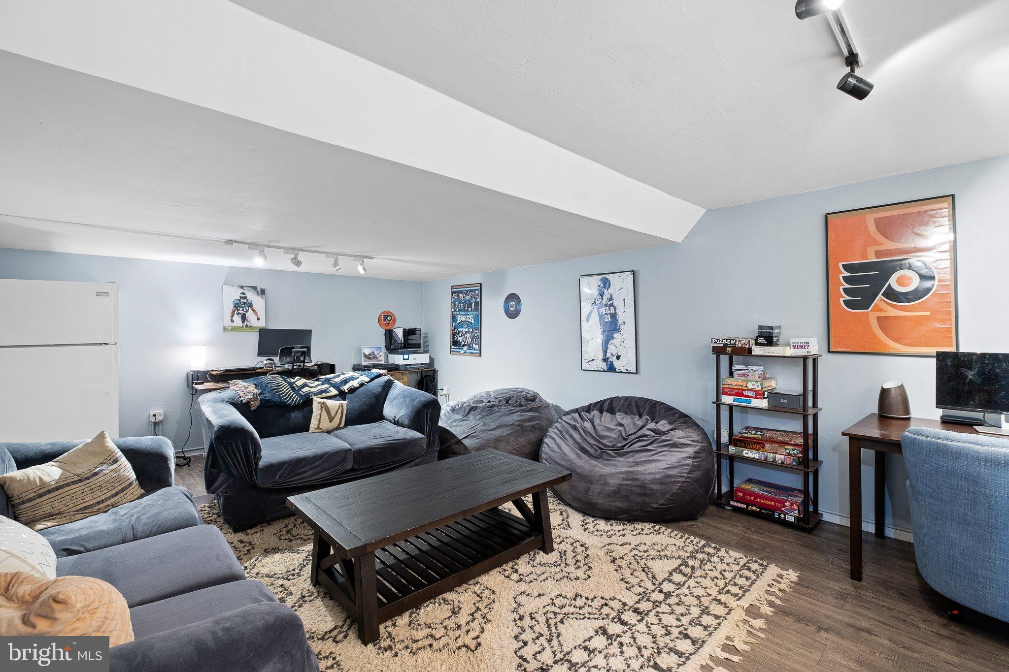 34 Sentry Lane Newark, DE 19711 - Photo 17 of 38 a living room with furniture a couch and a bookshelf