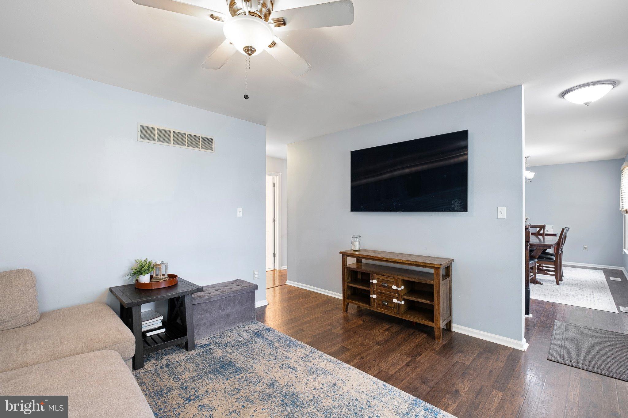 34 Sentry Lane Newark, DE 19711 - Photo 22 of 38 a living room with furniture and a flat screen tv