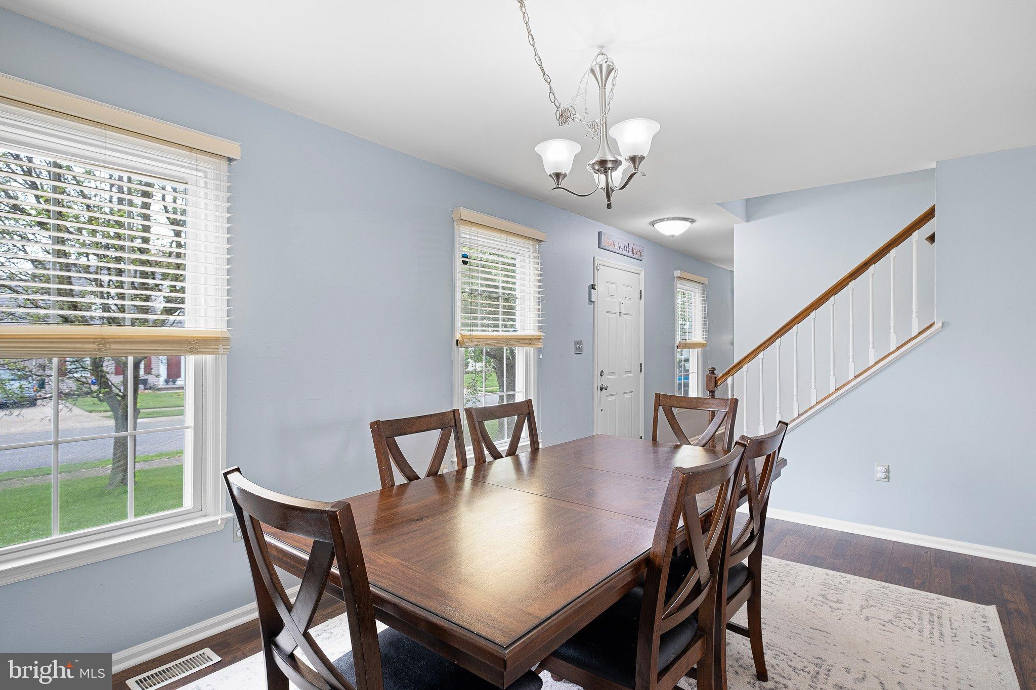 34 Sentry Lane Newark, DE 19711 - Photo 3 of 38 a view of a dining room with furniture window and wooden floor