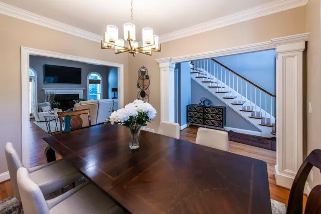 a kitchen with stainless steel appliances a sink stove refrigerator and cabinets