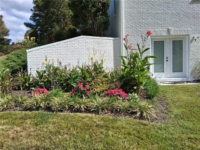 a view of a glass door with a bench