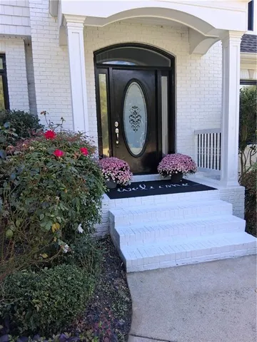 a living room with furniture fireplace and flat screen tv
