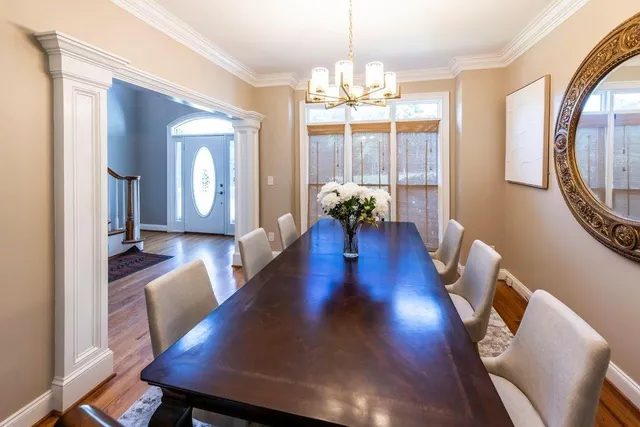 a view of an entryway with wooden floor