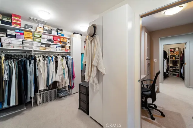a spacious bathroom with a tub sink and mirror