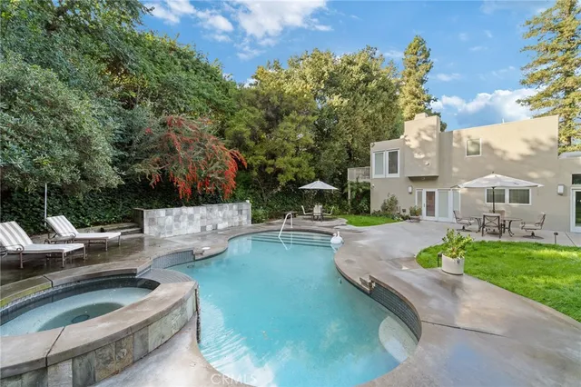 a patio with a yard table and chairs