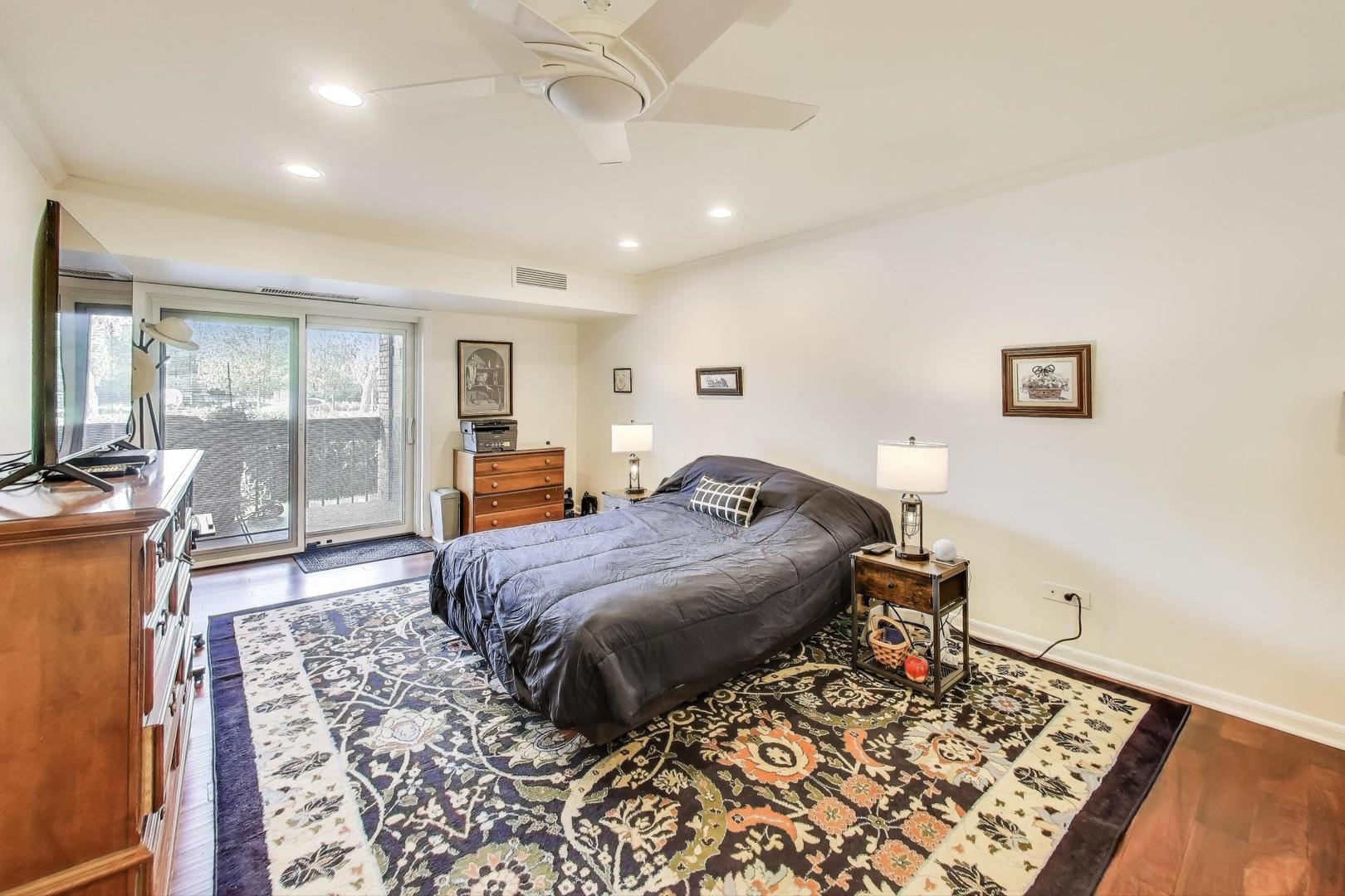 3955 Mission Hills Road, Unit D Northbrook, IL 60062 - Photo 12 of 26 a bedroom with bed and wooden floor