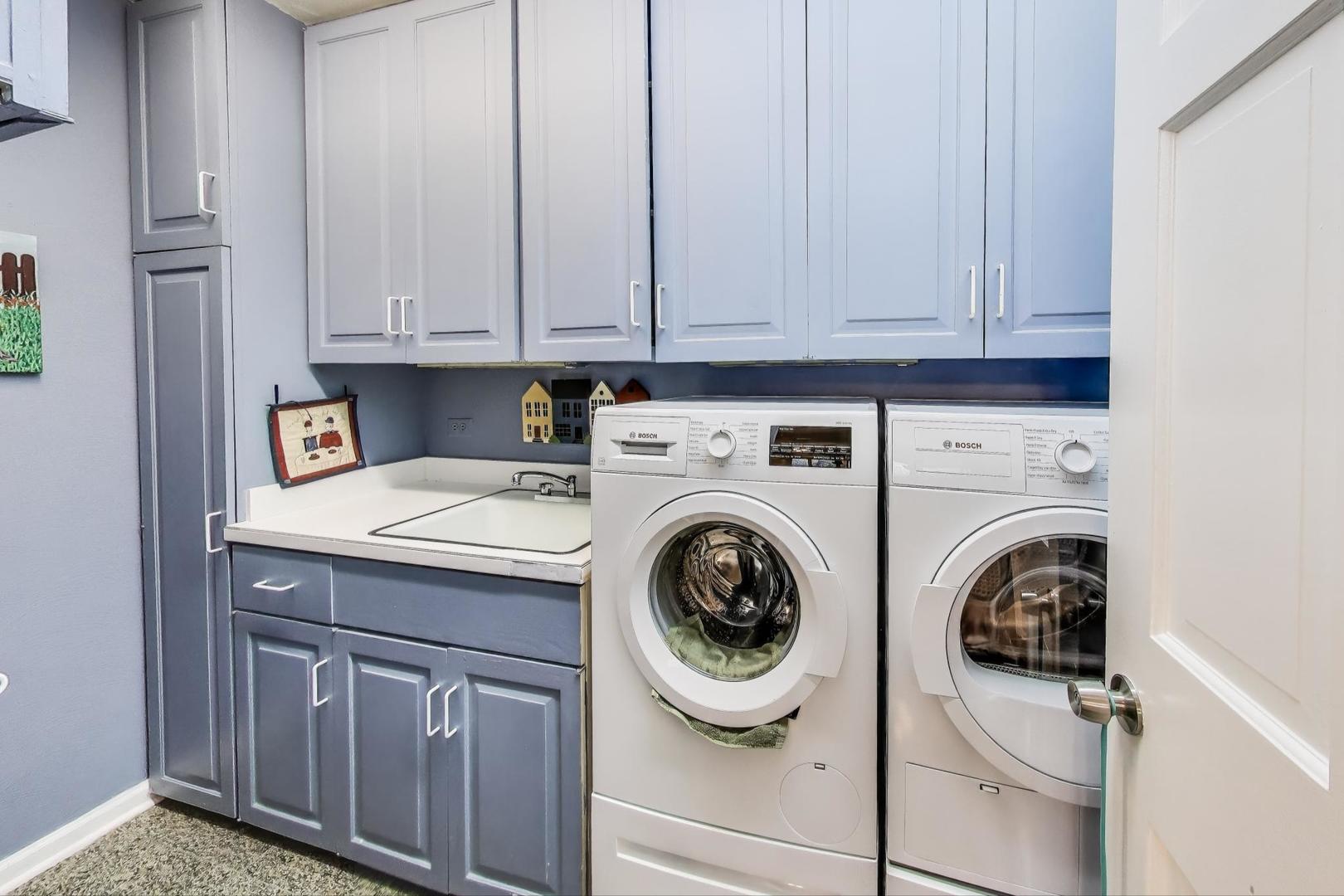 3955 Mission Hills Road, Unit D Northbrook, IL 60062 - Photo 19 of 26 a utility room with dryer and washer