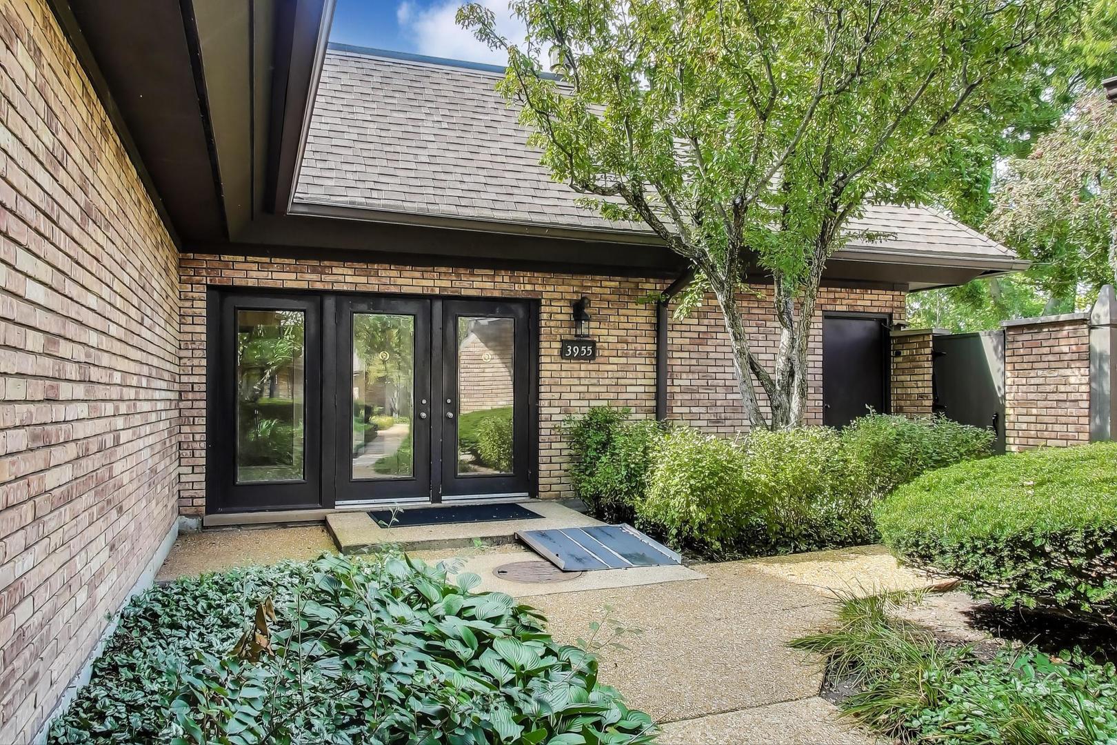 3955 Mission Hills Road, Unit D Northbrook, IL 60062 - Photo 2 of 26 a front view of a house with a porch