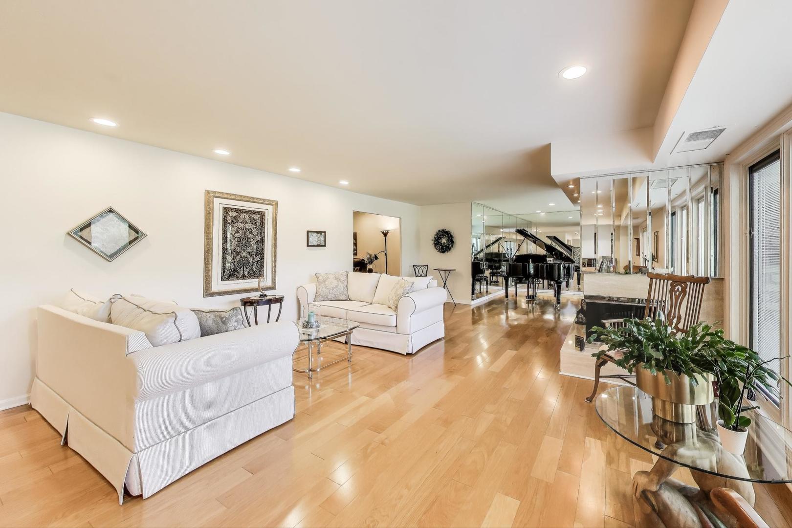 3955 Mission Hills Road, Unit D Northbrook, IL 60062 - Photo 5 of 26 a living room with furniture and a wooden floor