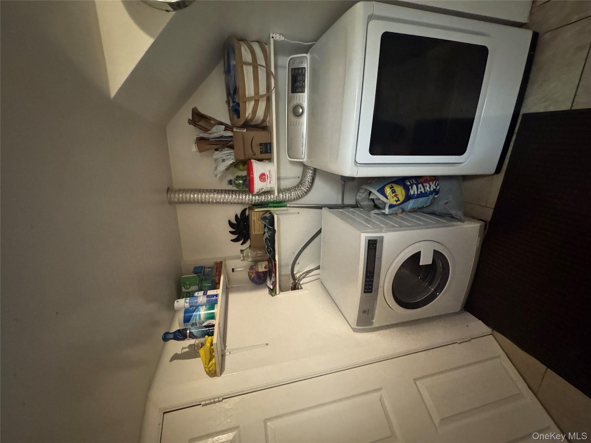 114-29 147th Street Queens, NY 11436 - Photo 12 of 12 a utility room with dryer and washer