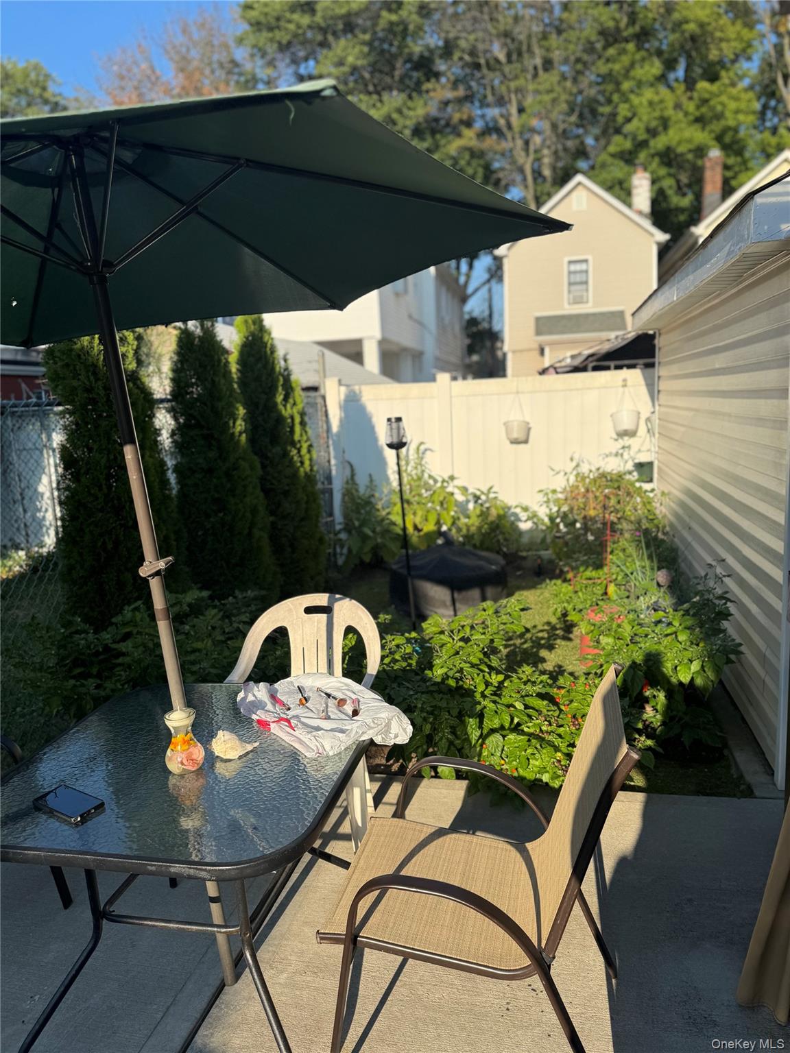 114-29 147th Street Queens, NY 11436 - Photo 2 of 12 a view of a couches and dinning table in patio