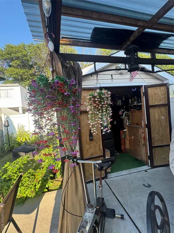 a view of a chairs and table in a patio