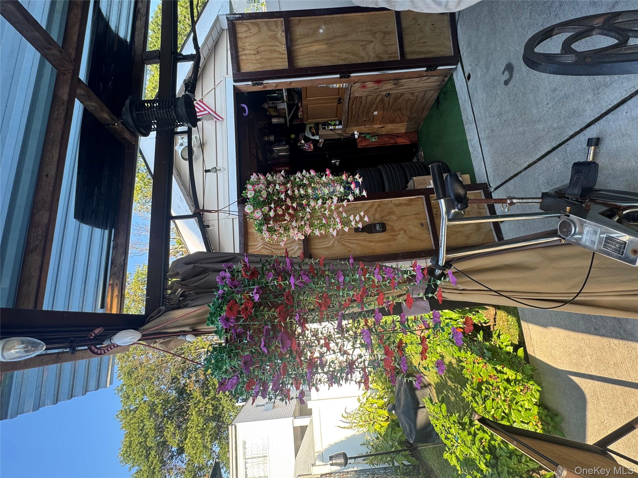 114-29 147th Street Queens, NY 11436 - Photo 4 of 12 a view of a chairs and table in a patio
