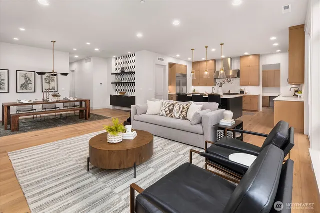 a view of a dining room with furniture window and wooden floor