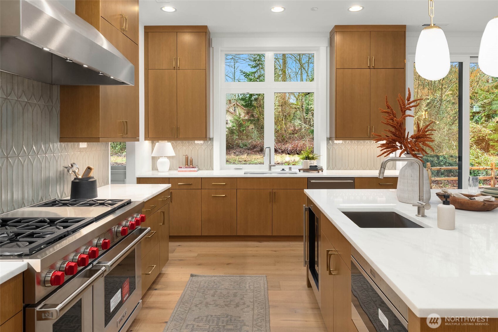 21021 Southeast 80th Street Issaquah, WA 98027 - Photo 20 of 38 a kitchen with a stove a sink and a large window