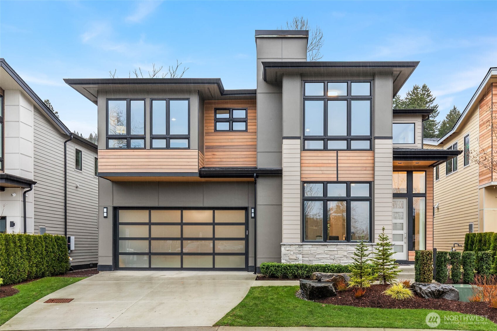 21021 Southeast 80th Street Issaquah, WA 98027 - Photo 2 of 38 a front view of a house with a yard