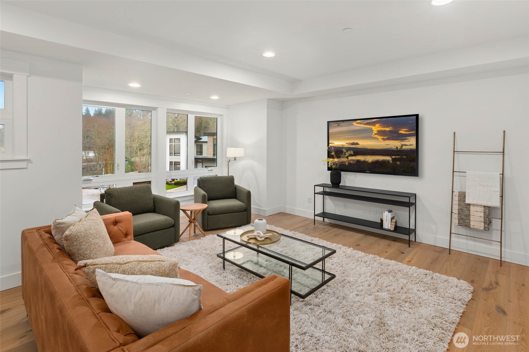 21021 Southeast 80th Street Issaquah, WA 98027 - Photo 25 of 38 a living room with furniture and a flat screen tv
