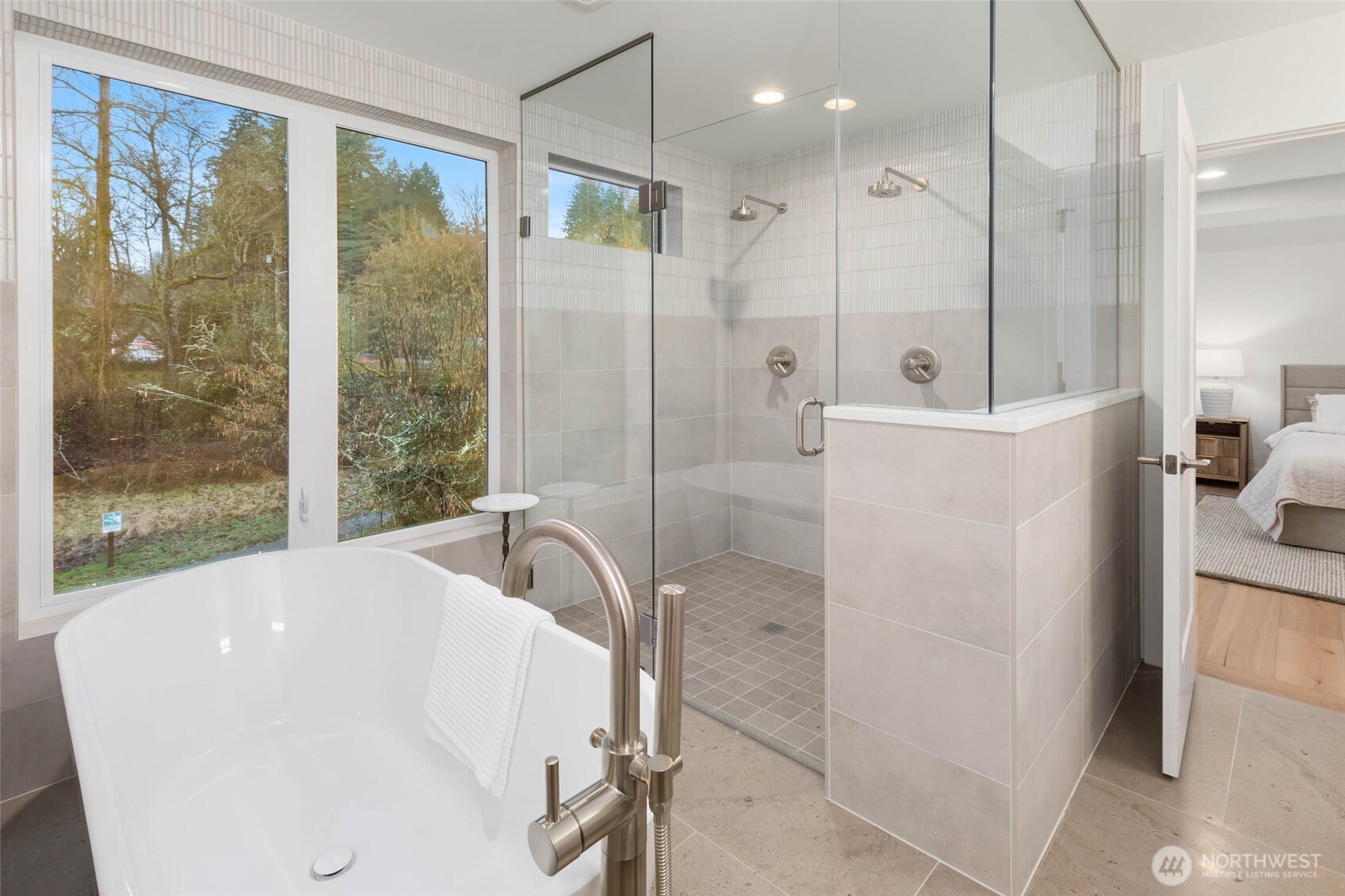 21021 Southeast 80th Street Issaquah, WA 98027 - Photo 29 of 38 a bathroom with a bathtub and a shower