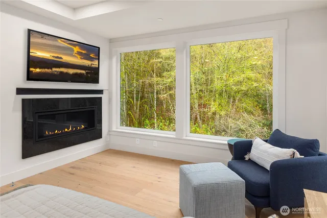 a bathroom with a tub a sink and a window